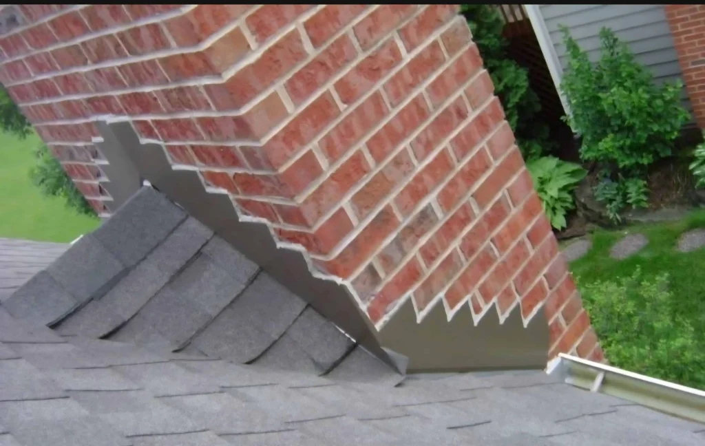 Professional chimney repair and installation in Indianapolis featuring watertight counter-flashing on a residential brick chimney by Emerson Masonry Inc.