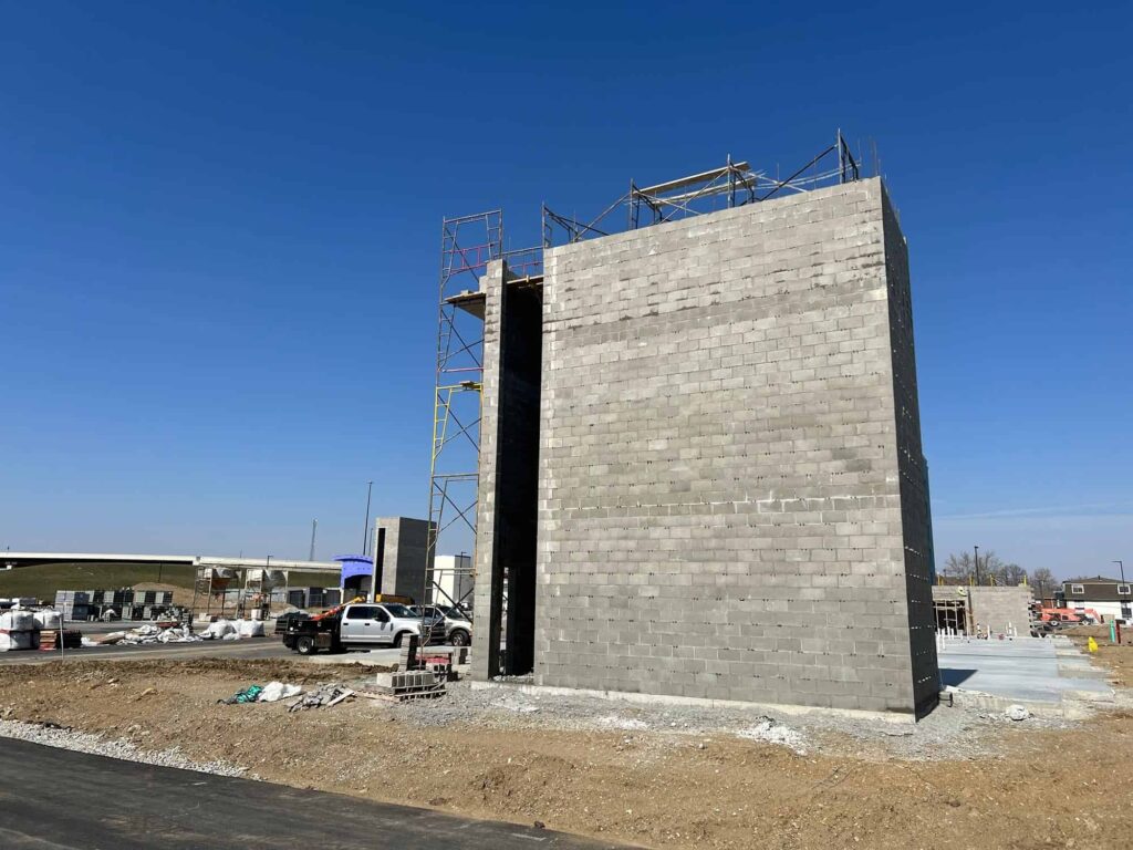 A wide exterior view of a massive, newly constructed commercial structure utilizing concrete block masonry Indianapolis services.
