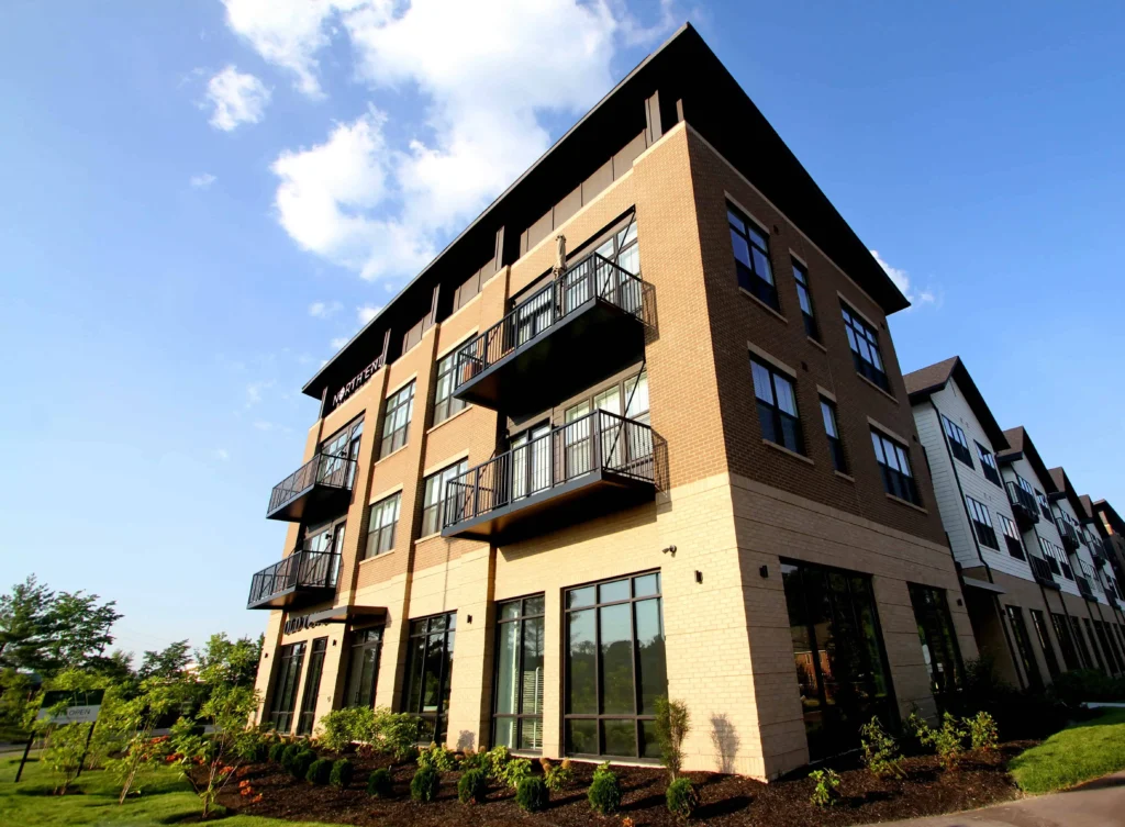 Modern commercial and residential mixed-use building with light brown and tan brick masonry maintained by the best brick repair service in Indianapolis.
