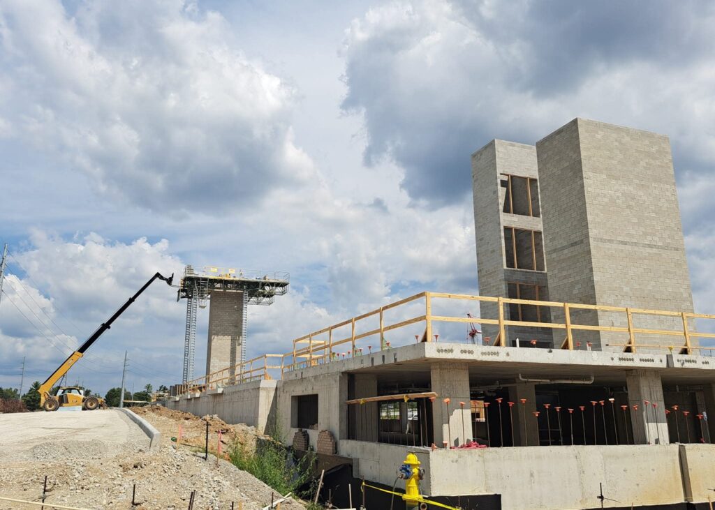 Concrete building construction site with crane